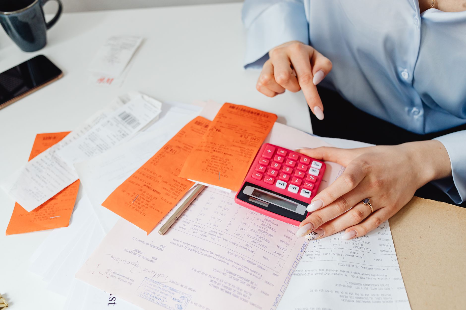 Receipts and a calculator on a desk
